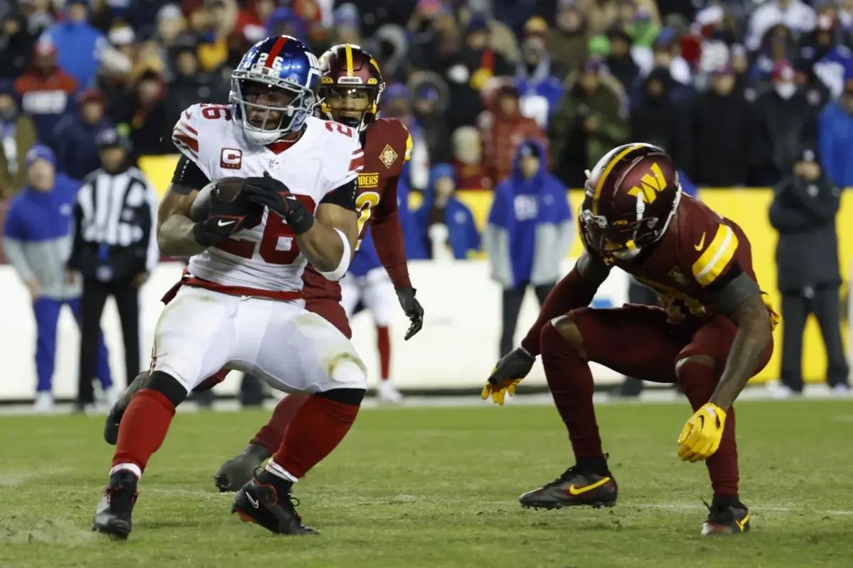New York Giants running back Saquon Barkley prompts a challenge for the Washington Commanders.